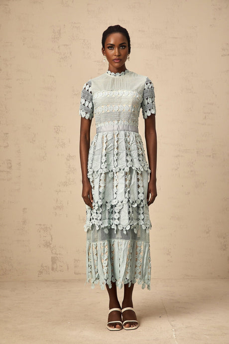 A green midi dress with floral embroidery details named Oceane