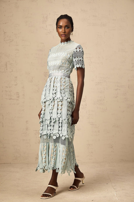 A green midi dress with floral embroidery details named Oceane