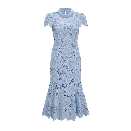 A light blue midi dress with delicate floral lace appliques covering the bodice and skirt creating an elegant and romantic silhouette
