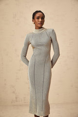 A long gold midi dress with ribbed knit texture and delicate pointelle details throughout the fabric