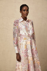 A matching set consisting of a cherry pink shirt and skirt both featuring a pattern print design