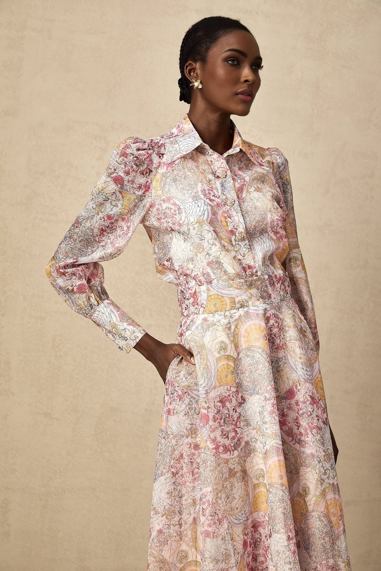 A matching set featuring a cherry pink shirt and skirt with a pattern print design