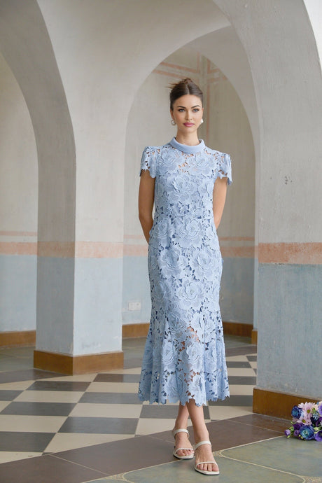 A midi dress in aurore blue featuring floral applique details on delicate lace fabric
