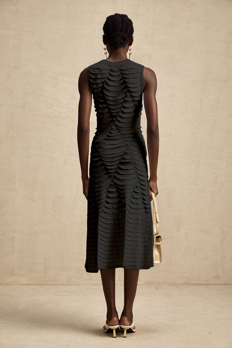 A midi dress with a snake pattern design and godet inserts for added flare