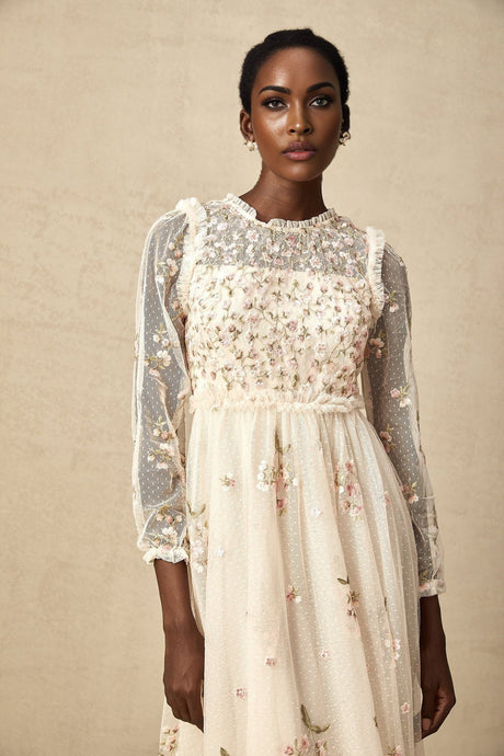 A midilength tulle dress with floral embroidery from Celine featuring delicate details and a feminine silhouette