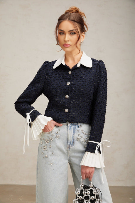 A navy blue tweed jacket with panelled design and structured silhouette featuring a classic collar and button closure named Doriane