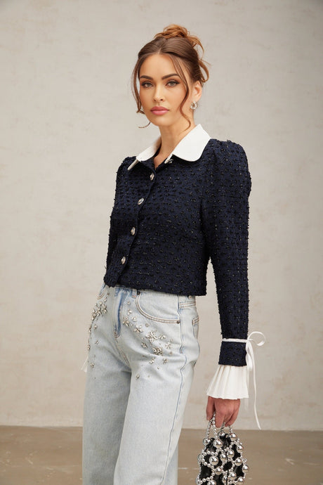 A navy blue tweed jacket with panelled design called Doriane