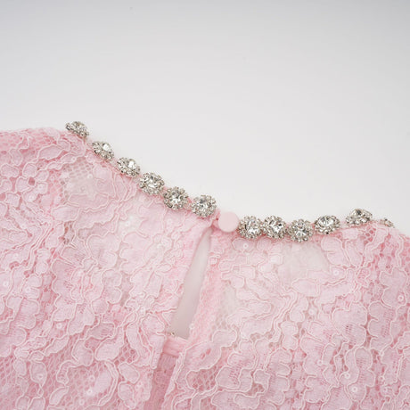 A pink lace midi dress with floral embroidery and embellishments created by Elisabetta featuring delicate details throughout the garment