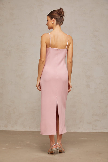 A pink midi dress with a corsetstyle bodice adorned with crystal embellishments featuring a feminine silhouette and elegant design