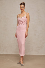A pink midi dress with a corsetstyle bodice adorned with crystal embellishments featuring a fitted silhouette and feminine design