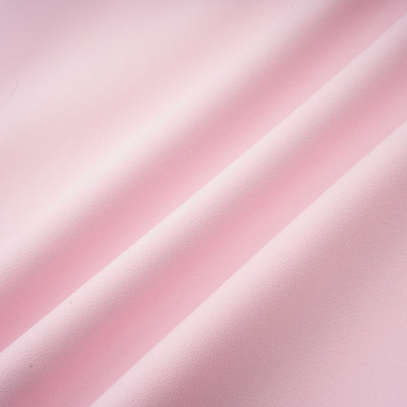 A pink midi dress with a crystalaccented bow and a silhouette inspired by the Cassiopeia constellation