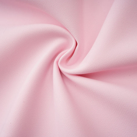 A pink midi dress with a crystalaccented bow detail and a Cassiopeiainspired design