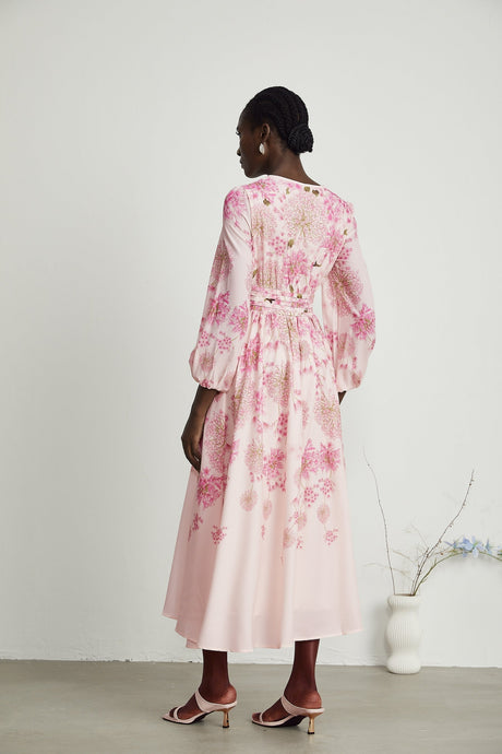 A pink midi dress with a floral print pattern called Yvette