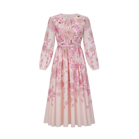 A pink midi dress with a floral print pattern covering the fabric named Yvette