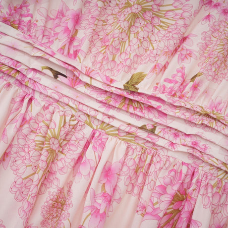 A pink midi dress with a floral print pattern named Yvette
