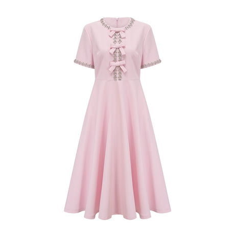 A pink midi dress with a large bow detail adorned with crystal accents named Cassiopeia