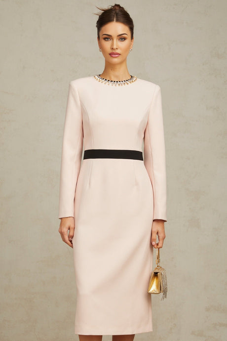 A pink midi dress with crystal embellishments and colorblocked design featuring the name Anais
