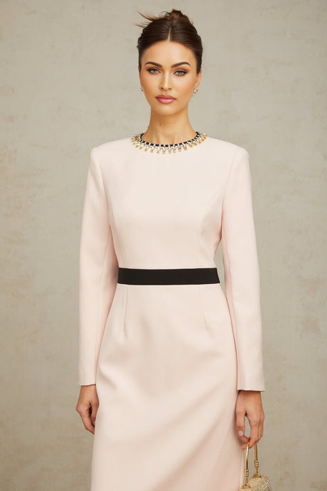 A pink midi dress with crystal embellishments and colorblocked design featuring the name Anais