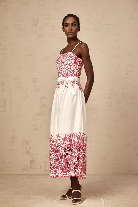 A pink midi dress with embroidery and cut out details named Beatrice