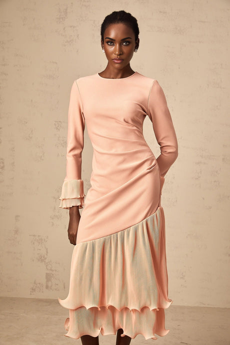 A pink midi dress with ruffled trim and panelled design featuring a feminine silhouette and delicate details