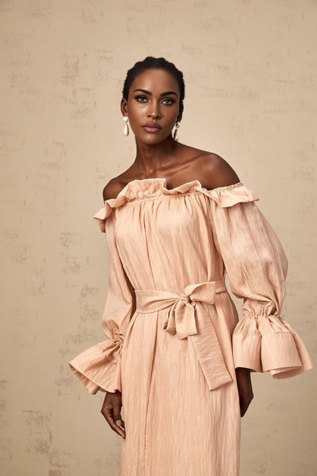 A pink midi dress with ruffles and a tied waist named Agathe