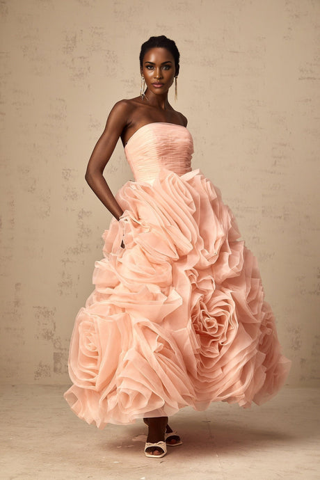 A pink offshoulder midi dress with 3D petal details made of tulle fabric featuring a feminine and romantic design