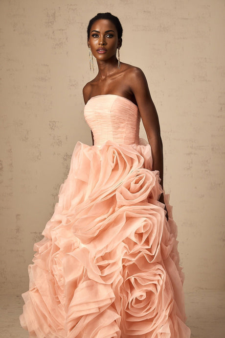 A pink offshoulder midi dress with 3D petal details on tulle fabric