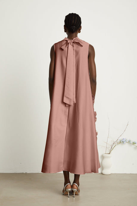 A pink sleeveless midi dress with floral applique details named Emilie