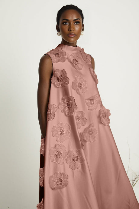 A pink sleeveless midi dress with floral applique details named Emilie