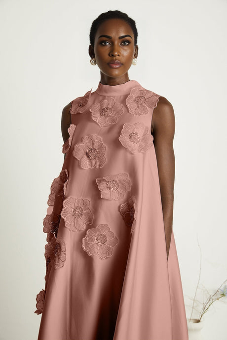 A pink sleeveless midi dress with floral applique details named Emilie