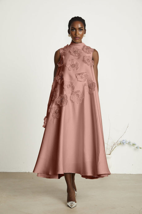 A pink sleeveless midi dress with floral applique details named Emilie