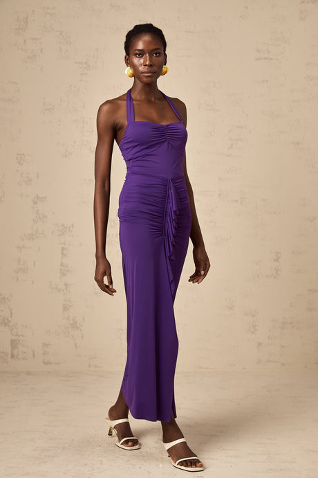 A purple midi dress with a halterneck design and ruched detailing called the Renata