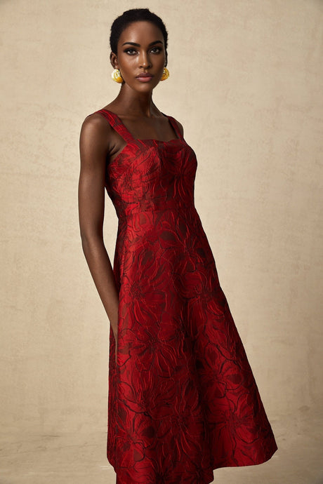 A red midi dress with a floral jacquard pattern and the name Helene