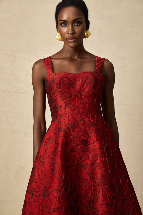 A red midi dress with a floral jacquard pattern featuring a feminine silhouette and named Helene
