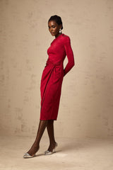 A red midi dress with a high slit and gathered fabric detail worn by a model