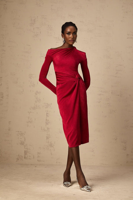 A red midi dress with a high slit and gathered fabric details worn by a model