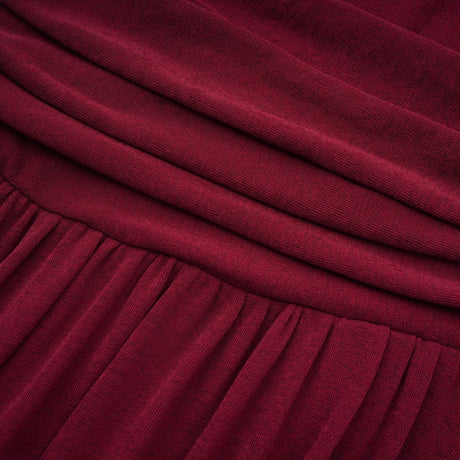 A red midi dress with ruched detailing and a flap design named Camille