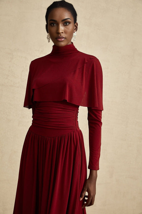 A red midi dress with ruched detailing and a flap design named Camille