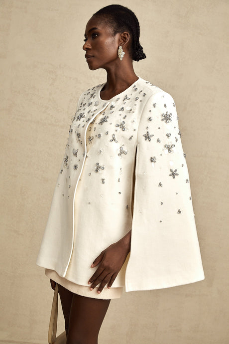 A stylish jacket with capelike design featuring embellishments named Eleonore