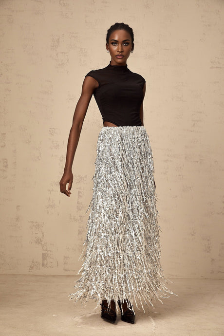 A twopiece matching set featuring a corsetstyle top and skirt in contrasting tones named Virginie The top has a structured bodice design while the skirt complements the look in a coordinating color