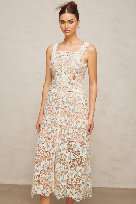 A white Aline midi dress with floral lace pattern covering the entire garment featuring a fitted bodice and flared skirt