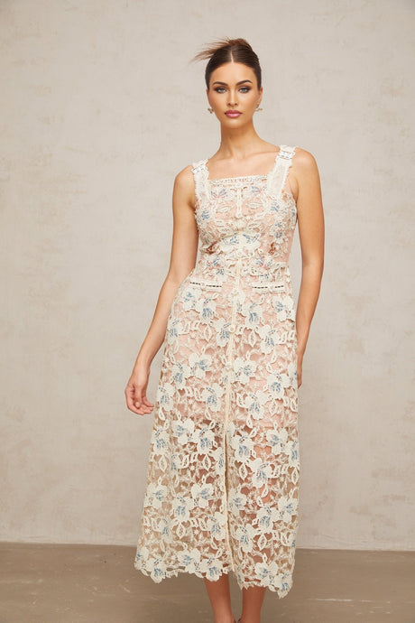 A white Aline midi dress with floral lace pattern featuring a fitted bodice and flared skirt