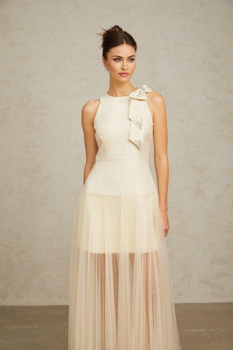A white midi dress with a bow detail and tulle panels named Therese