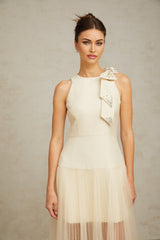 A white midi dress with a bowknot detail and tulle panels named Therese