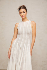 A white midi dress with puff sleeves and a pointelle knit pattern named Helene