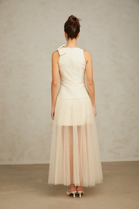 A white midi dress with tulle panels and a bow detail named Therese