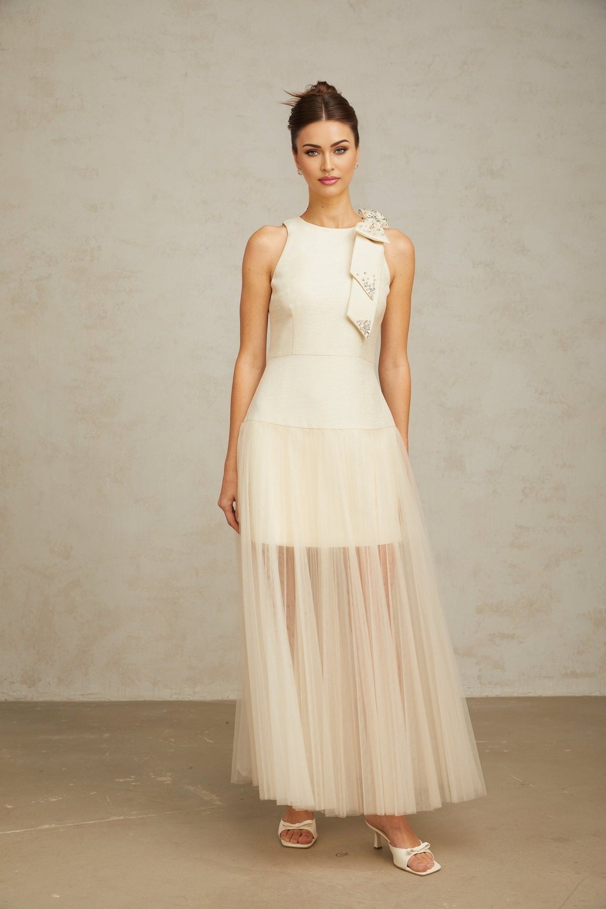 A white midi dress with tulle panels and a bowknot detail named Therese