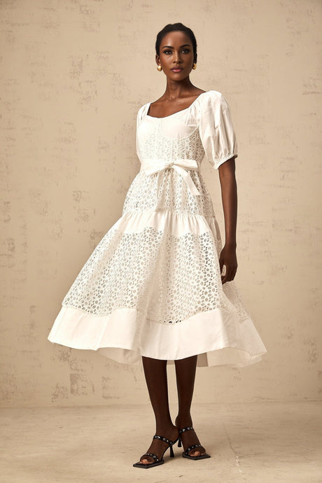 A white tiered midi dress made of corded lace with a feminine and elegant design named Helene