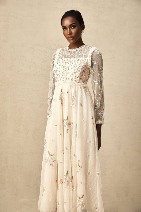 A white tulle midi dress with delicate floral embroidery featuring a Celine design with a fitted bodice and flowing skirt