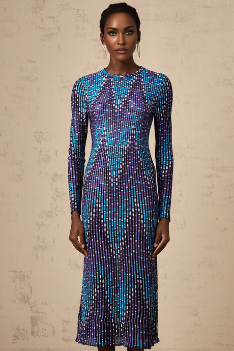 A woman wearing a zigzag patterned knitted midi dress with long sleeves standing against a plain background